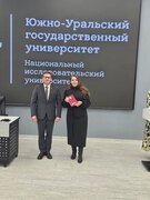 Вручение диплома кандидата наук М. А. Матвеевой.